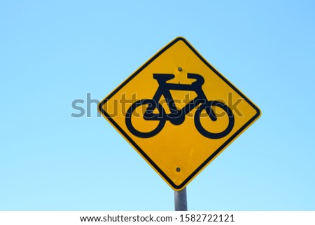 Bicycle road traffic sign on a clear sky background