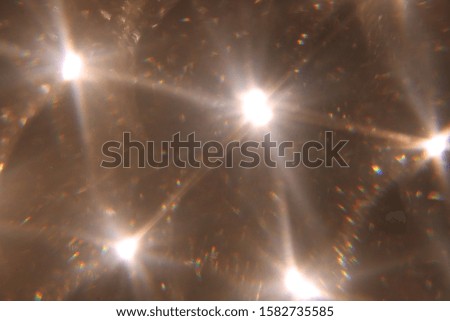 Easy to add overlay or screen filter over photos. Abstract sun burst. Digital lens flare background. Gleams rounded and hexagonal shapes, rainbow halo, iridescent glare.
