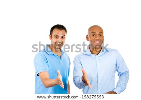 Closeup portrait of two young friendly men, happy coworkers; smiling, happy young business partners, students giving hand shake, isolated on white background. Corporate life, deal making. 