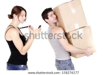 Young man holding cardboard box on white background. 