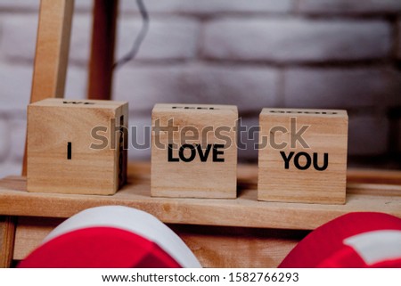 Wooden block with description: I love you on white background, Copy space.