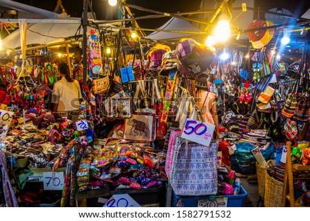 Souviners for sale at Sunday Walking Street Market Chiang Mai Royalty-Free Stock Photo #1582791532