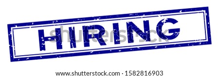 Grunge blue hiring word square rubber seal stamp on white background