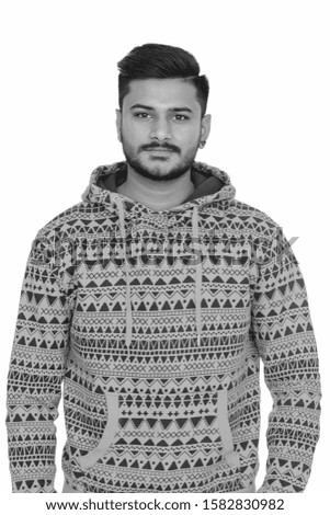 Young handsome Indian man with hoodie in black and white