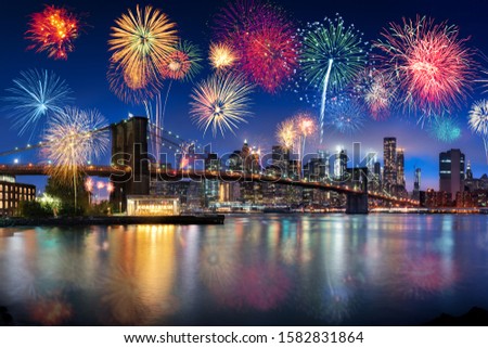 Manhattan skyline at night with fireworks, New York City, USA