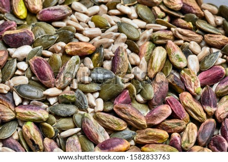 Cashews, pistachio, pumpkin seeds, sunflower seeds in plastic boxes Royalty-Free Stock Photo #1582833763
