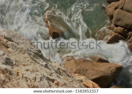 Beautiful waves hitting rock. photo taken in Britanny France 