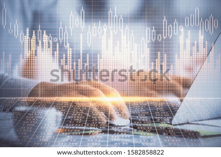 Double exposure of forex graph with man working on computer on background. Concept of market analysis.