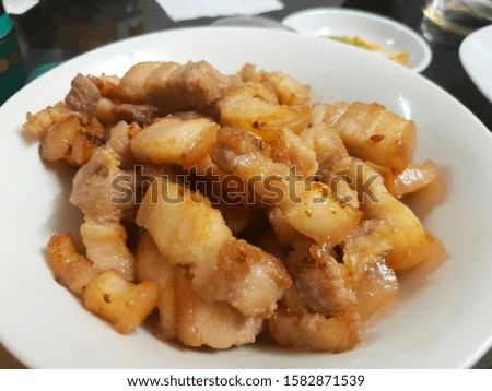 Homemade fried pork belly with fish sauce Royalty-Free Stock Photo #1582871539