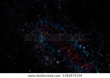 Design blank for the decoration of fantastic intergalactic plots. Abstract dark background similar to the starry sky and the Milky Way. The concept of space research and astronomical phenomena.
