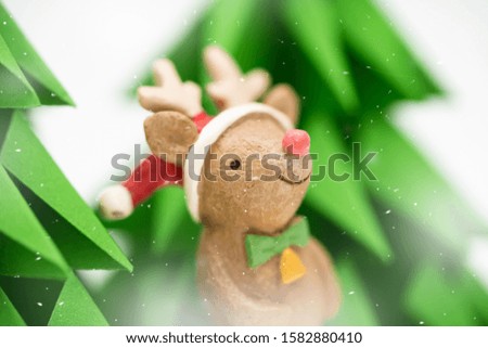 Set of cartoon miniature Christmas isolated on white.Funny happy Santa Claus, Reindeer and snowman on christmas tree with snowflakes ready for season.For Christmas cards, banners and background.