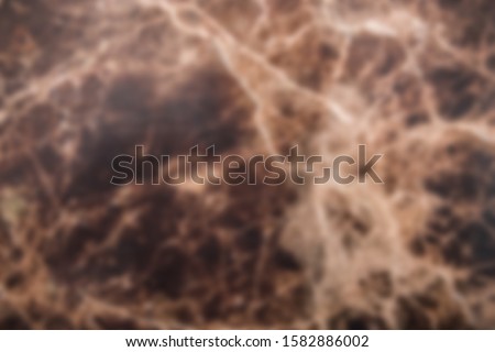 Brown blurred cracked marble floor tile texture background