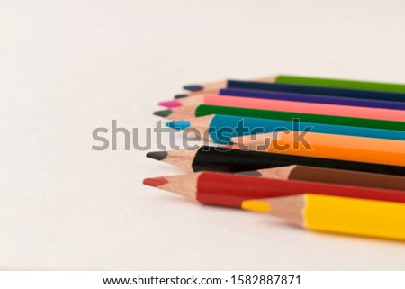A set of colored pencils. Isolated on white background. Selective focus