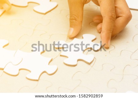 closeup shot of a white jigsaw puzzle