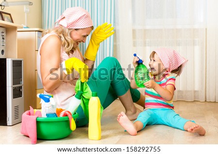 happy mother with kid cleaning room and having fun Royalty-Free Stock Photo #158292755