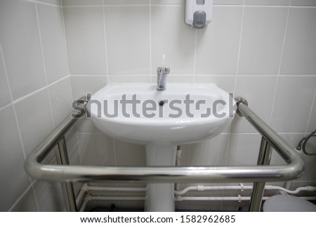 toilet for disabled person, toilet and toilet paper, handle bar for supporting