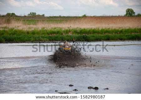 ATV during the competition overcomes a difficult area. Khabarovsk region. Summer