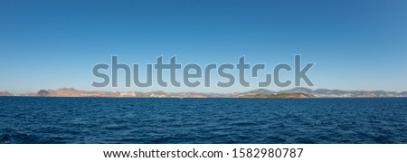 Mediterranean coast of the Aegean Sea Turkish coast and view of the port city of Bodrum, boat trip from Kos city to Bodrum Royalty-Free Stock Photo #1582980787