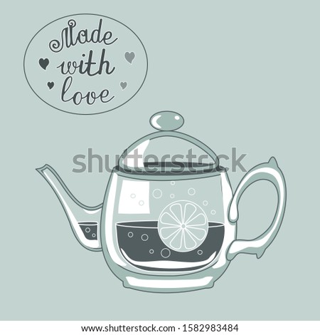 glass teapot on background with the inscription Made with love