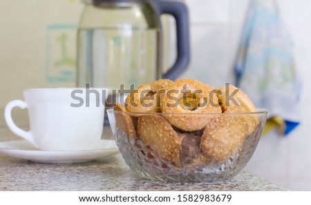 delicious sugar cookies in a bowl served with tea