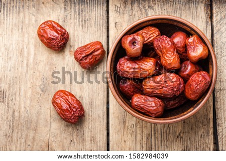 Bowl of dried unabi fruit or jujube.Space for text Royalty-Free Stock Photo #1582984039