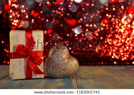  beautiful shiny heart with gift and shiny background