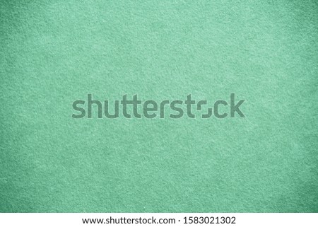 antique colored paper background texture with dark in old distressed vintage design. Colour of paper turquoise , christmas texture