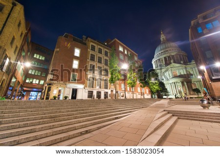 Old buildings of London at night with St Paul Cathedral on the background, UK.