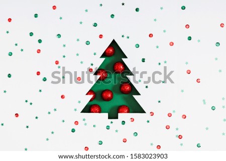 Christmas holiday composition. Xmas tree made of decorations on white background. Christmas, New Year, winter minimal concept. Flat lay, top view, copy space
