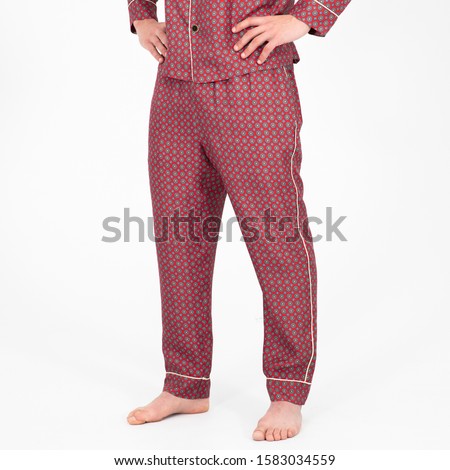 An isolated closeup shot of a person wearing  dark pink pajamas