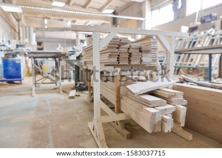 Background carpentry woodworking woodshop, machines and tools, wooden boards, furniture details Royalty-Free Stock Photo #1583037715