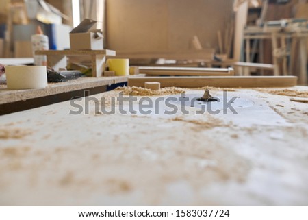 Background carpentry woodworking woodshop, machines and tools, wooden boards, furniture details Royalty-Free Stock Photo #1583037724