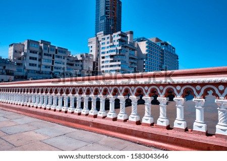 Bridge of London with red and white parapet.