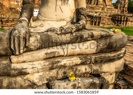 Closeup or weathered  Buddha statue at Wat Mahathat, Buddhist temple in Ayutthaya, at Ayutthaya Historical Park, UNESCO World Heritage Site