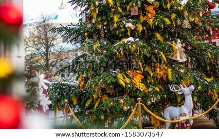 Decorated Christmas tree on blurred background. Nature New Year concept. Copy space for your text.