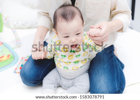 Mother and smiling Japanese baby