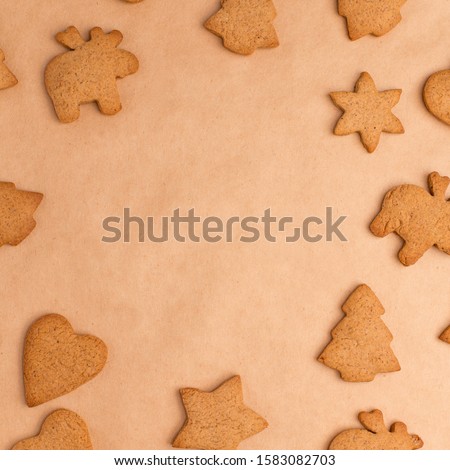 background with ginger different biscuits on craft paper, free space in the center