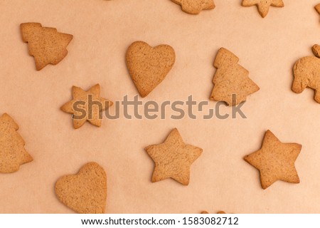 background with ginger different biscuits on craft paper