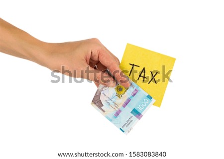 Thousand hryvnias and sticker with different financial signs and symbols in the hand, isolated on white