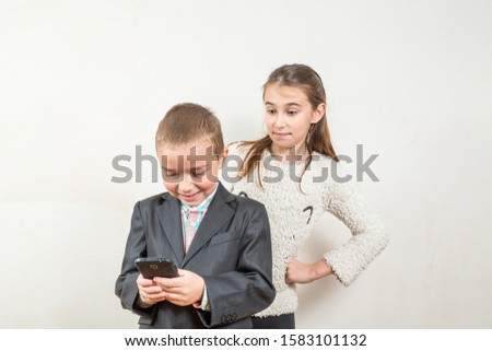 boy and girl look at the phone, human emotions