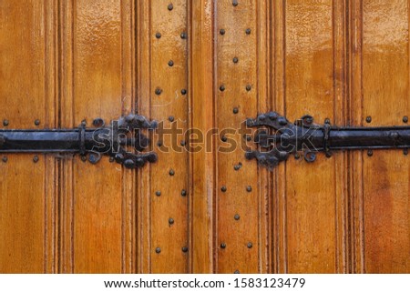A close-up of the massive wooden doors of a church in Enkhuizen, The Netherlands
