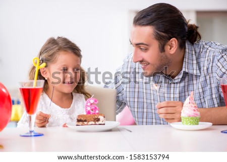 Father celebrating birthday with his daughter
