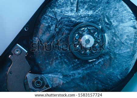 Close up beautiful open detail frozen hard disk on a white table background. Concept protection information or save usser data. Top view.
