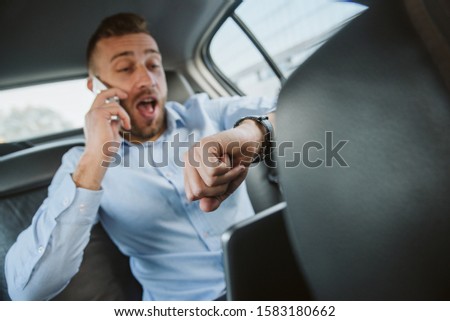 We'll be late for work! Businessman in a car