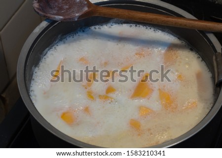 Complete preparation of pumpkin soup with plate