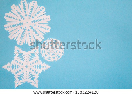 Snowflakes from paper on a white background