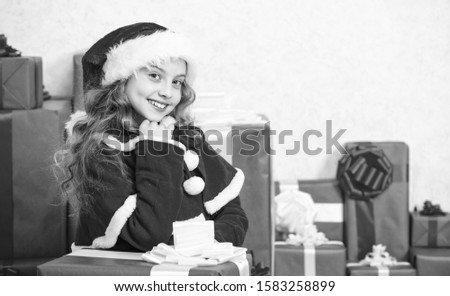 Winter holiday tradition. Kid happy with christmas present. Girl celebrate christmas open gift box. Opening christmas gift. Santa bring her gift. Unpacking christmas gift. Happy new year concept.