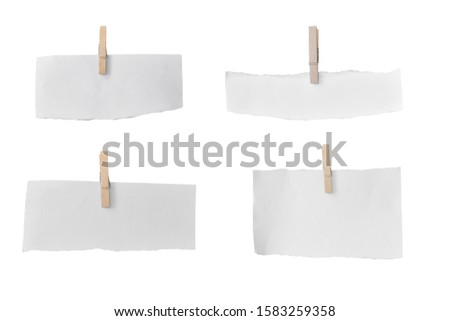 Set of wooden clip and white paper torn isolated on white background. Object with clipping path
