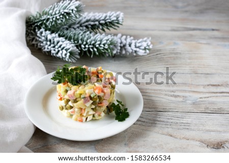 Olivier salad is a popular New Year's dish in Russia. Royalty-Free Stock Photo #1583266534