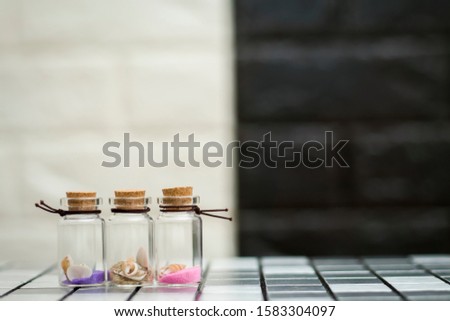 Shells in three small glass bottles